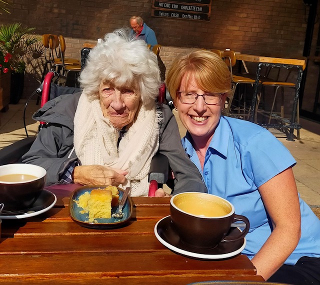 Driving Miss Daisy franchisee with customers next to steam train